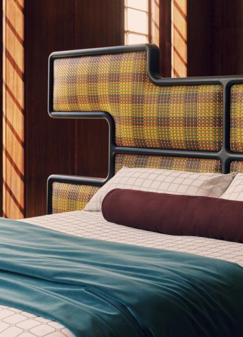 The patterned woven-leather headboard frames the Authenticity bed.