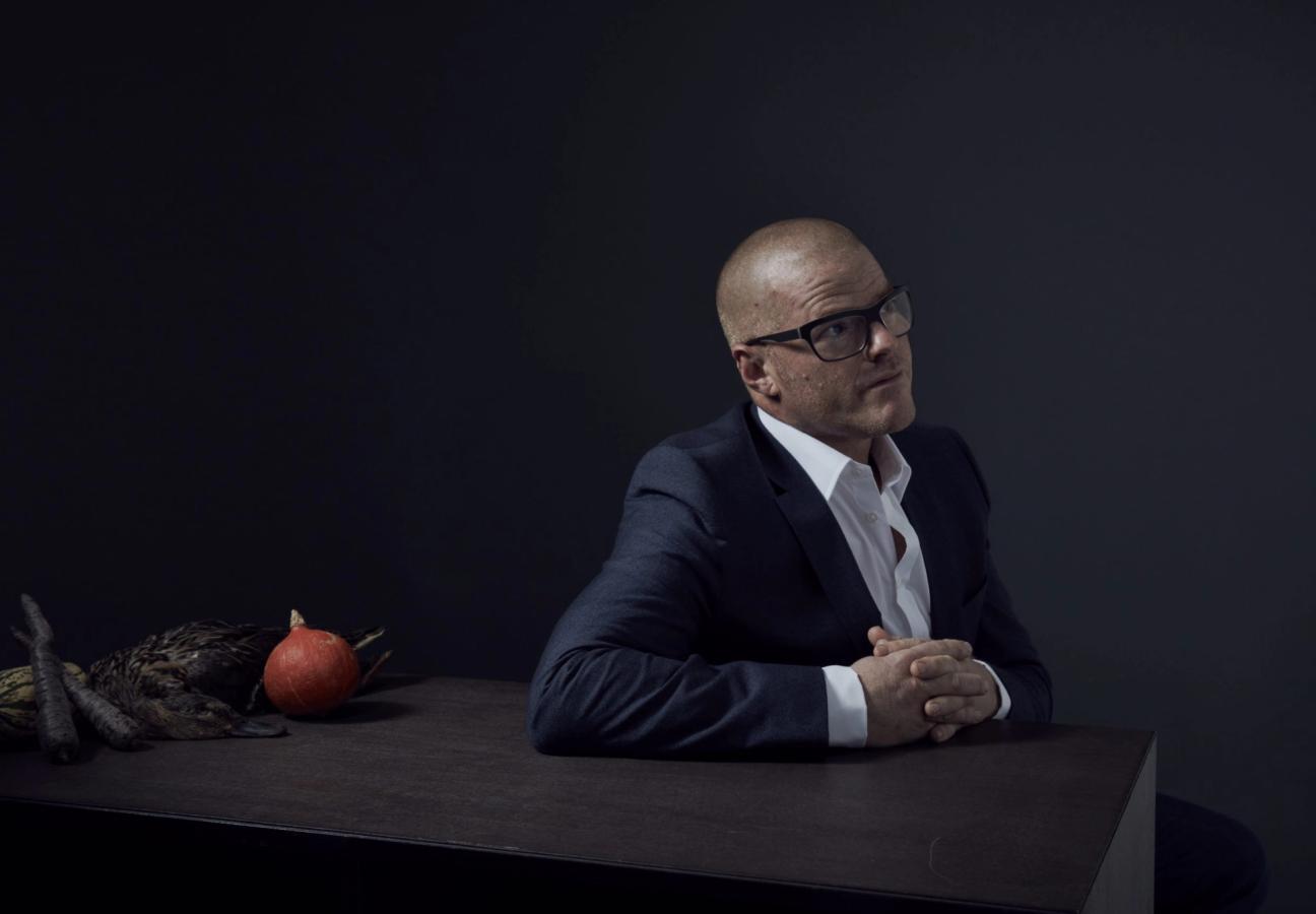heston blumenthal wears glasses in a suit