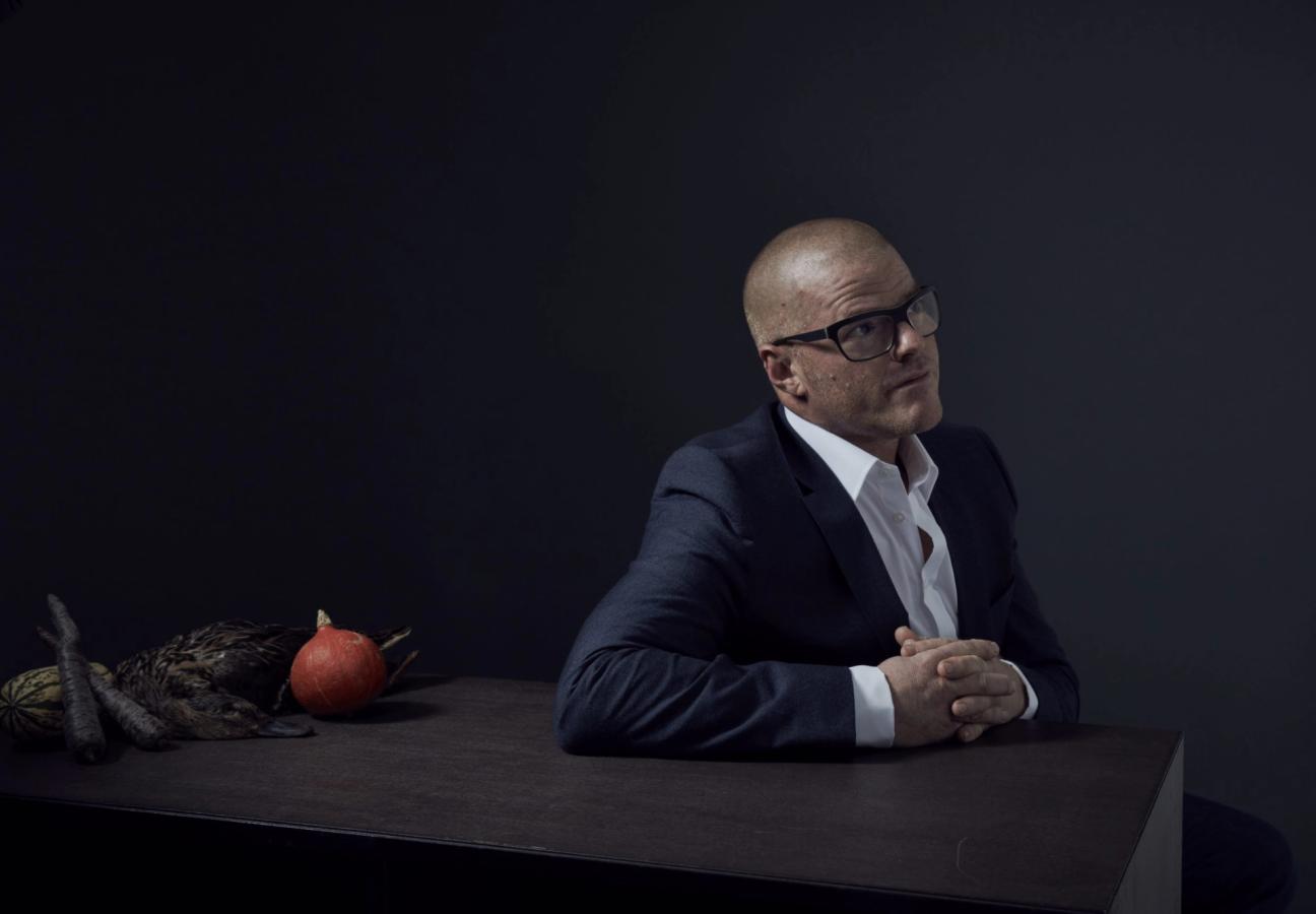 heston blumenthal wears glasses in a suit