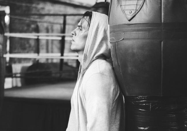 Model wears hoodie in boxing gym, photographed by Adam Fussell for Gentleman's Journal