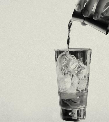 Pouring a drink over ice
