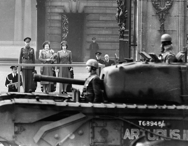 1944 - King George VII, the Queen Mother and Elizabeth watch a passing Churchill tank. (Popperfoto:Getty)