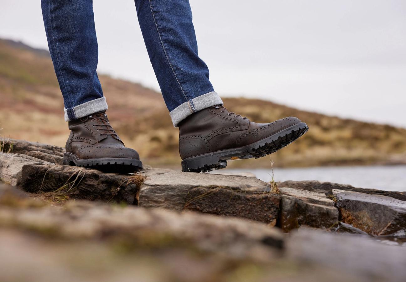 Man wearing Crockett & Jones Islay shoes in Dark Brown Rough-Out Suede around the Trossachs