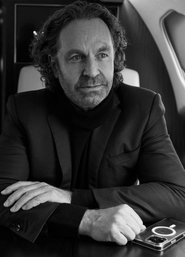 Black and White photo of Thomas Flohr aboard his private jet