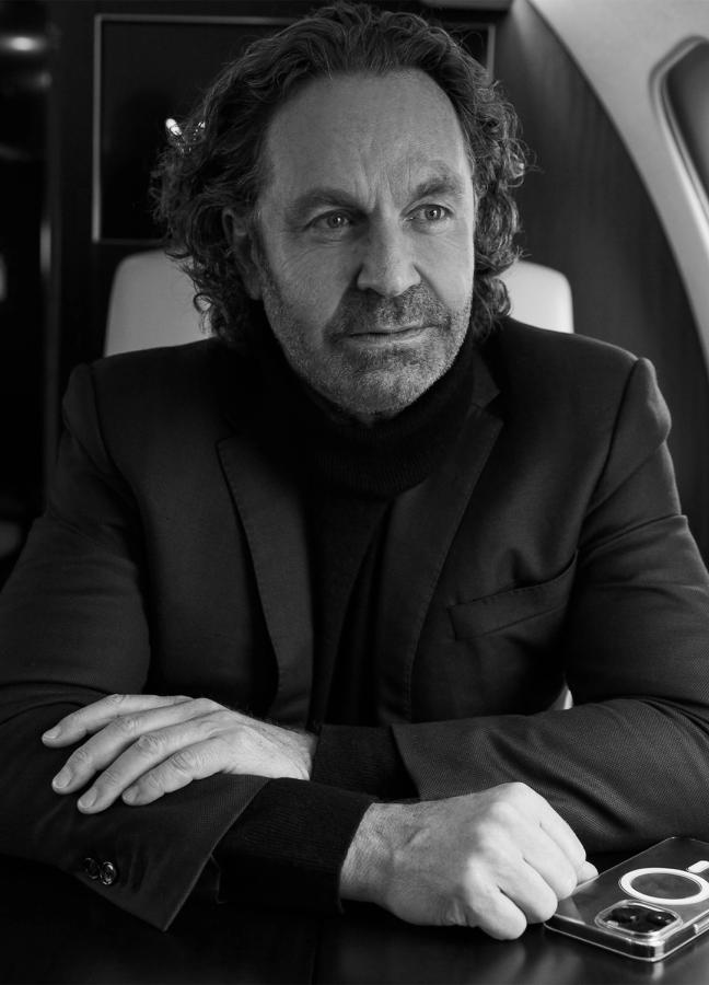 Black and White photo of Thomas Flohr aboard his private jet