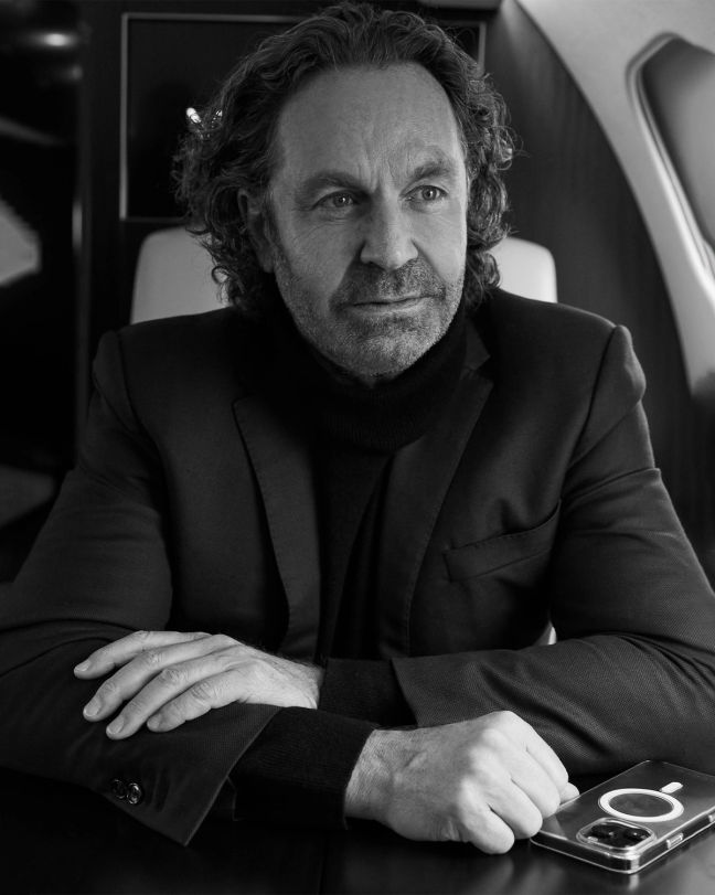 Black and White photo of Thomas Flohr aboard his private jet