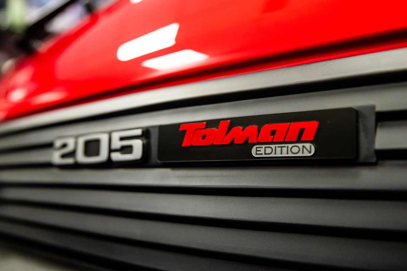 Close up of Red Peugeot 205 GTi Tolman Edition rear logos