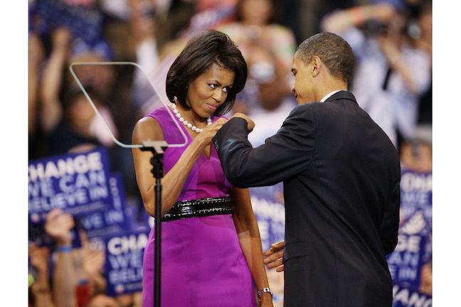 ST. PAUL, MN - JUNE 3: Democratic presidential candidate Sen. Barack Obama (D-IL) (R) and his wife Michelle Obama bump fists at an election night rally at the Xcel Energy Center June 3, 2008 in St. Paul, Minnesota. Obama clinched the Democratic presidential nomination following today's primaries in South Dakota and Montana, although his rival Sen. Hillary Clinton (D-NY) has not yet conceded the race. (Photo by Scott Olson/Getty Images)