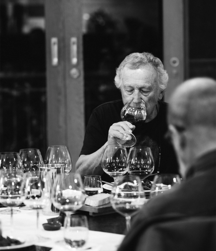Black and white photo of Pinot Noir with a meal