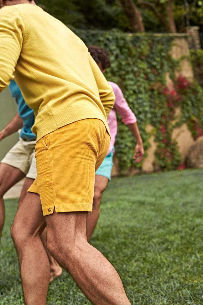 Group of people playing outside wearing Mr Marvis shorts