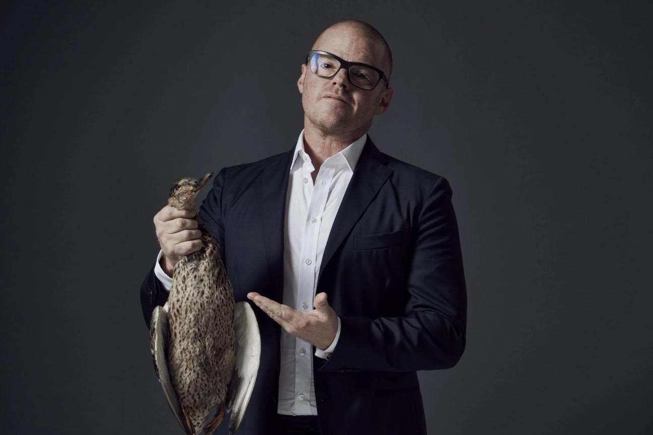 heston blumenthal wears glasses in a suit