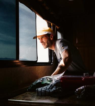 Matt Taylor leaning out a window