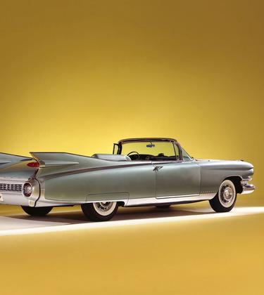 Rear view of a Cadillac Eldorado Biarritz in a yellow setting