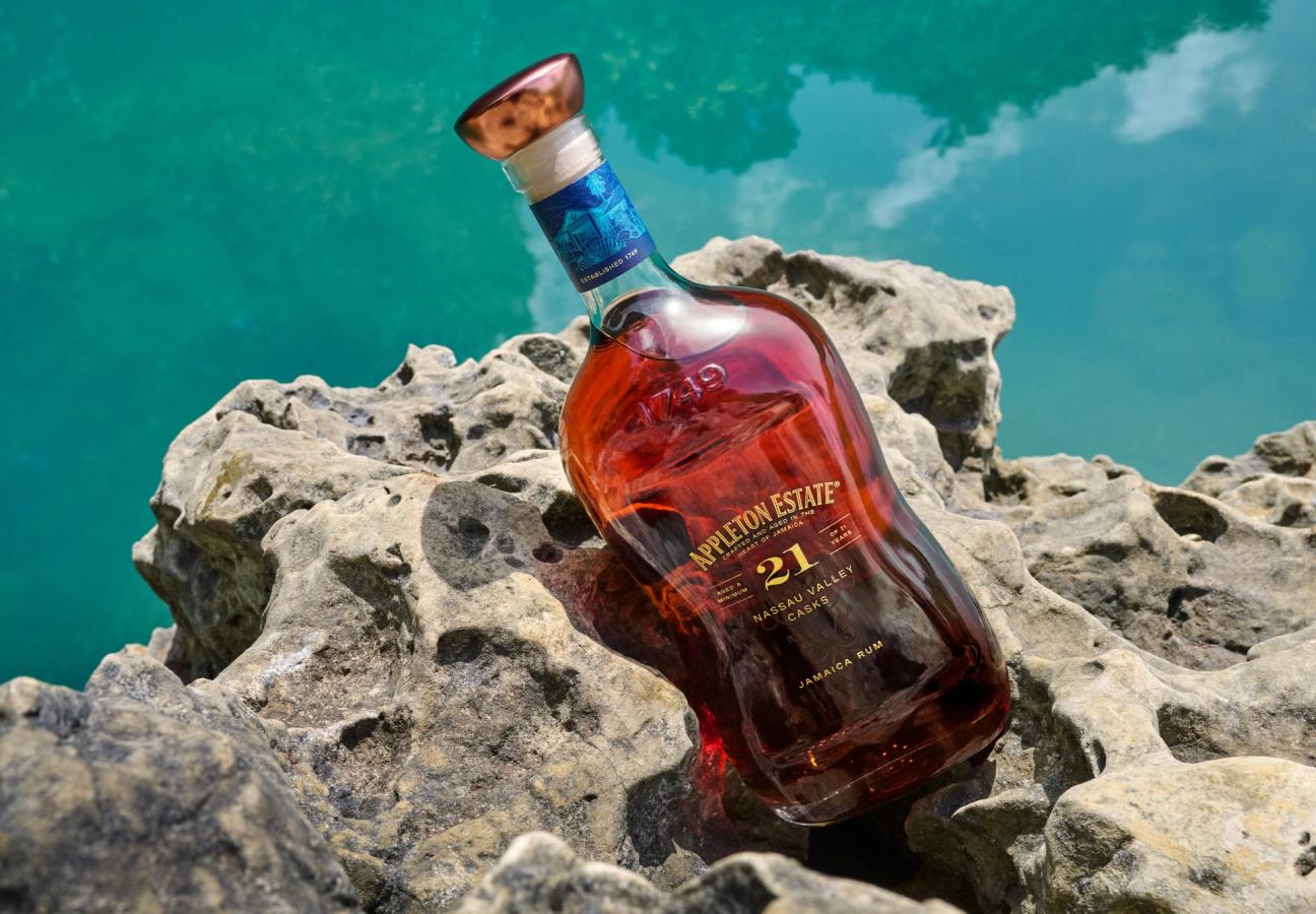 Appleton Estate 21 Nassau Valley Casks rum bottle on coastal rocks