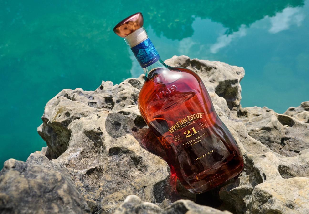 Appleton Estate 21 Nassau Valley Casks rum bottle on coastal rocks