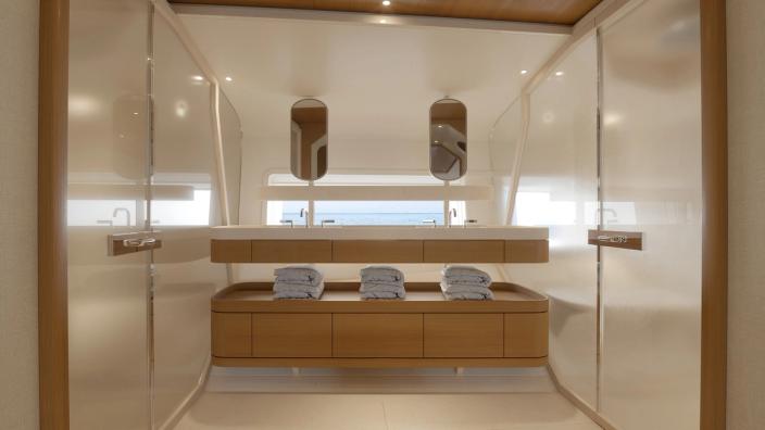 The bathroom continues the interior’s restrained approach to materials and proportions. Rendering.