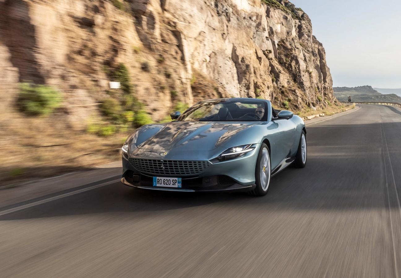 Ferrari Roma Spider driving along coastal road