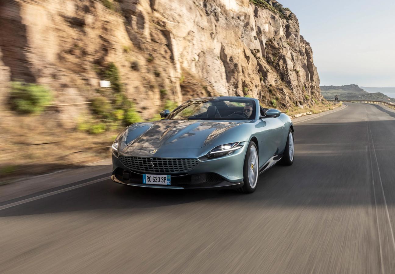 Ferrari Roma Spider driving along coastal road
