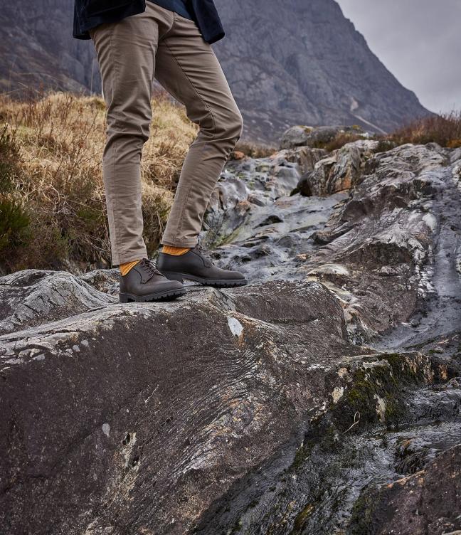 Man wearing Crockett & Jones Lanark 3 shoes in Dark Brown Rough-Out Suede around the Trossachs