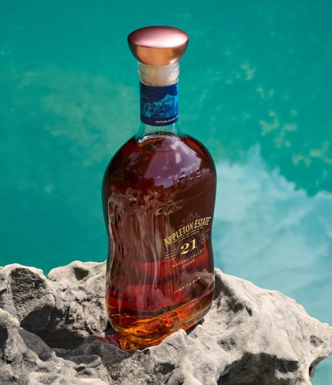 Appleton Estate 21 Nassau Valley Casks bottle of rum next to a river