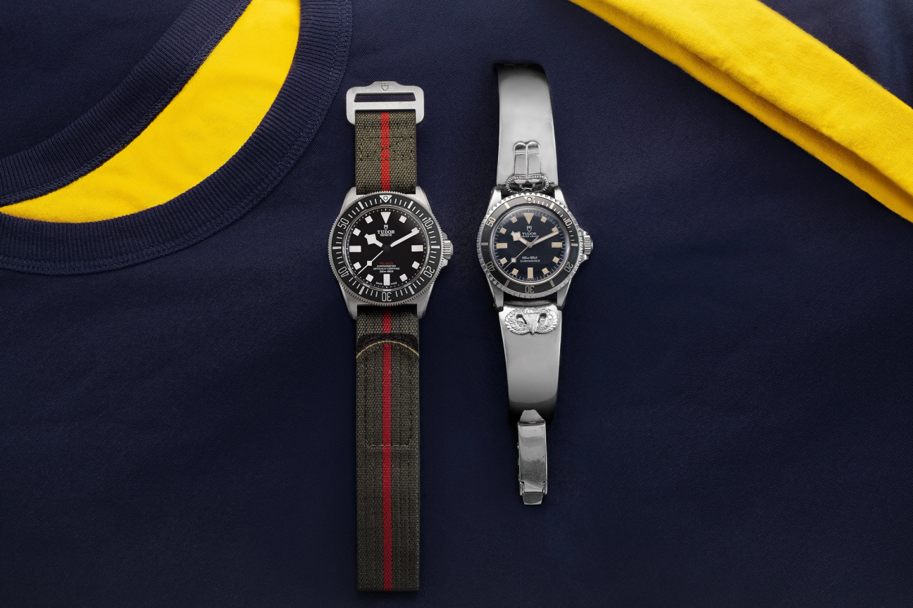 Two Tudor Pelagos FXD watches placed on a navy jumper