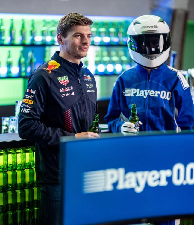 Max Verstappen holding bottle of Heineken 0.0