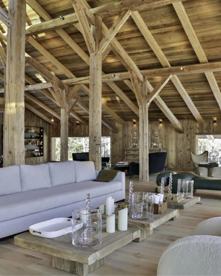 Timber-beamed living room at Fermes à La Leonthine