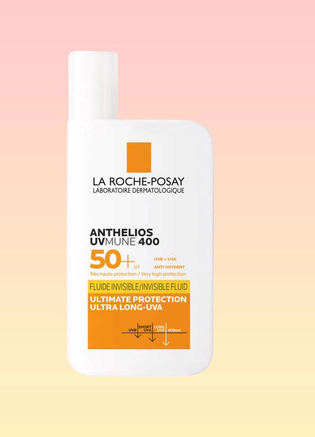 La Roche-Posay Anthelios UVMune 400 Invisible Fluid SPF50+ bottle on a pink and yellow background
