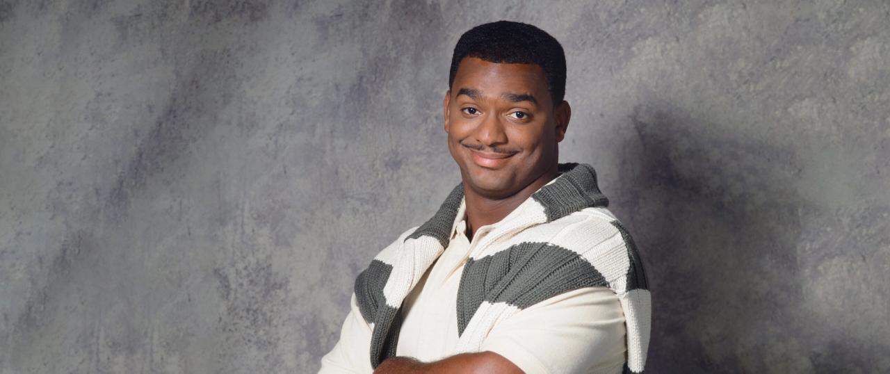 Carlton Banks, from The Fresh Prince of Bel-Air, wearing a jumper over shoulders