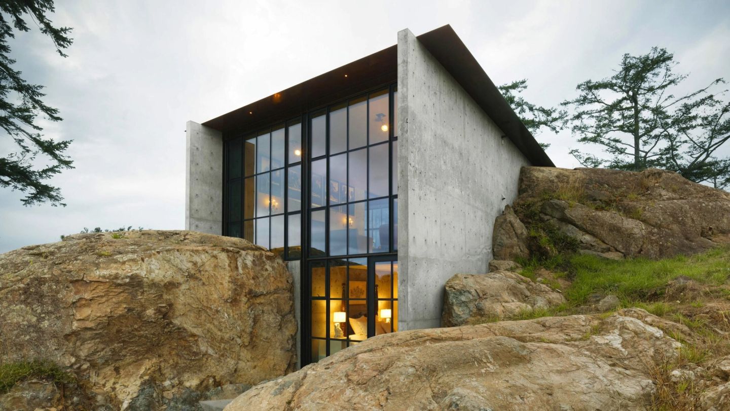 This stunning modern home is carved into the rockface of the Washington wilderness