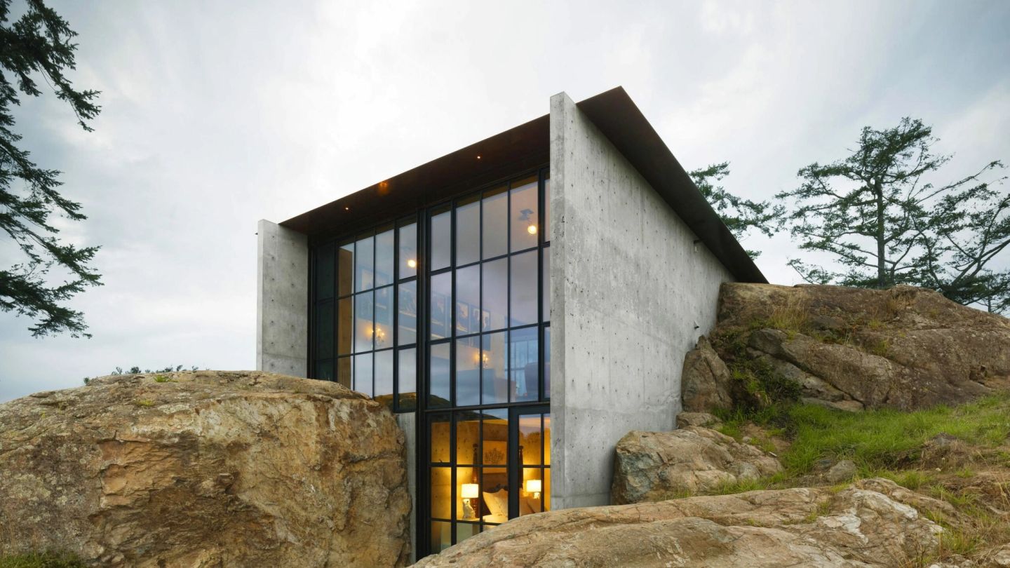 This stunning modern home is carved into the rockface of the Washington wilderness