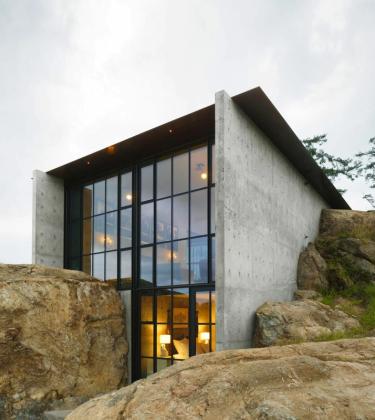 This stunning modern home is carved into the rockface of the Washington wilderness