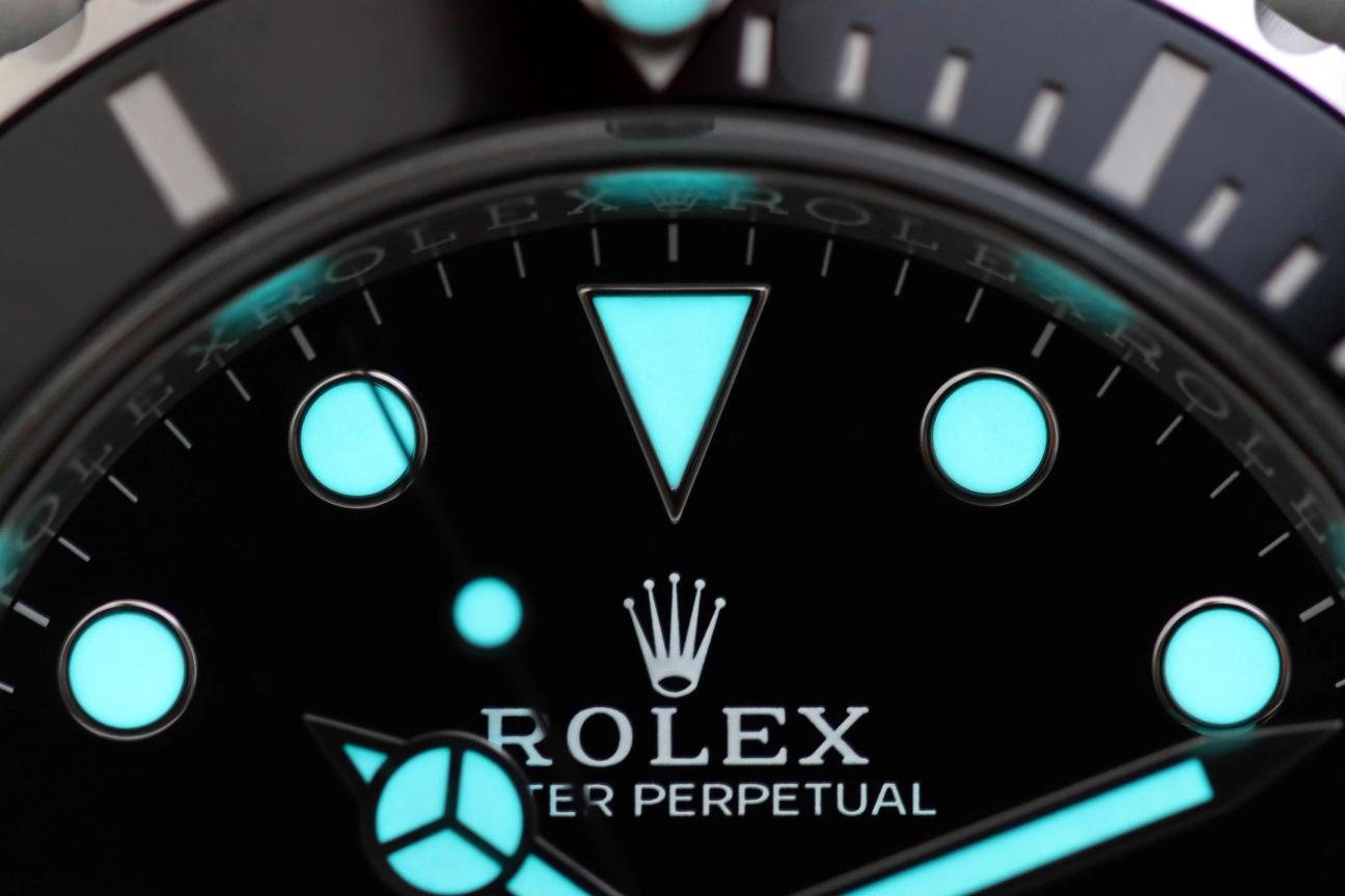 Close up of Rolex watch face with glow in the dark elements