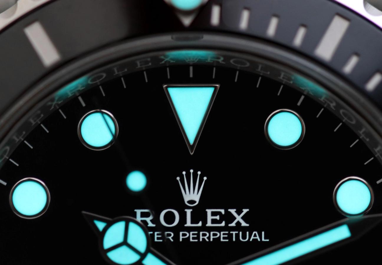 Close up of Rolex watch face with glow in the dark elements