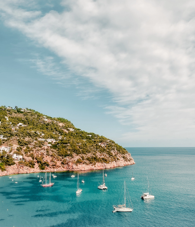 Coastal waters of Ibiza with several anchored boats