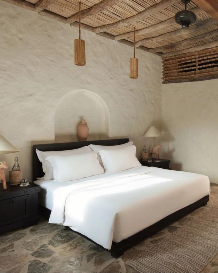 Bedroom in a stone villa at Six Senses Zighy Bay