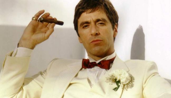 Al Pacino wearing white suit and holding cigar