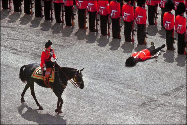 1970 - The Queen passes a fainted Guardsman while inspecting the troops. (Getty Images)
