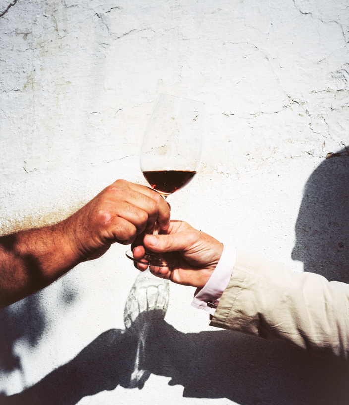 Glass of Port being shared