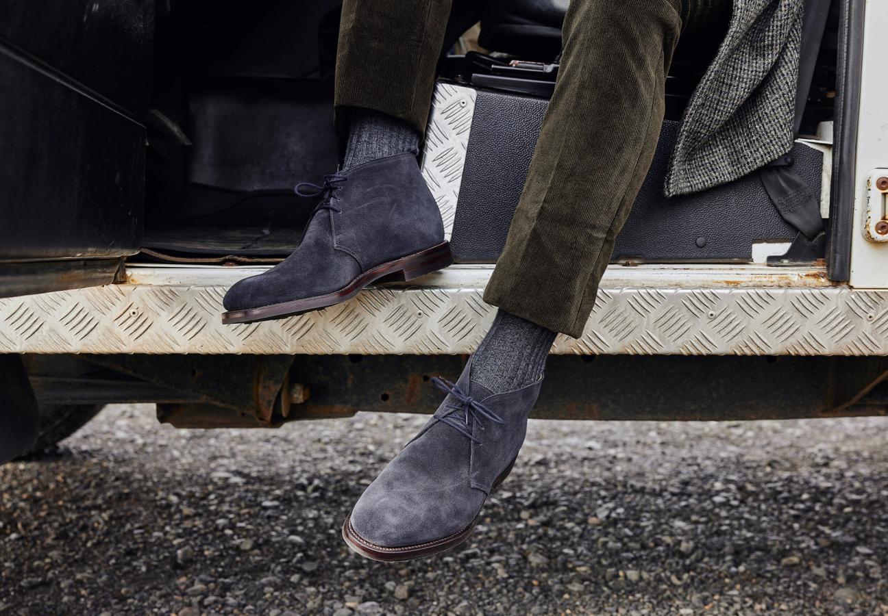 Man wearing Crockett & Jones’s Navy Suede chukka boot
