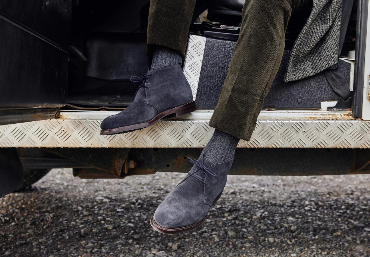 Man wearing Crockett & Jones’s Navy Suede chukka boot