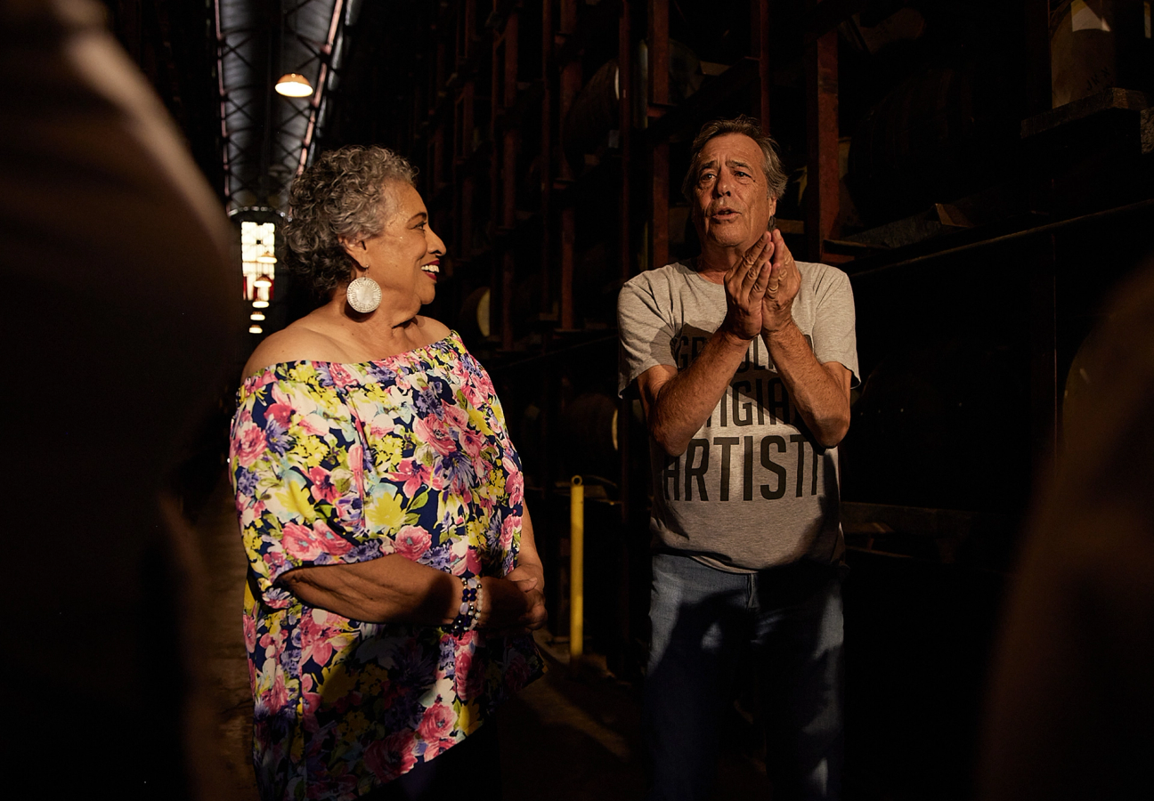 Joy Spence, Master Blender of Appleton Estate, and rum collector Luca Gargano standing in a cellar