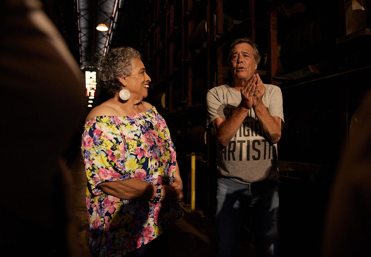 Joy Spence, Master Blender of Appleton Estate, and rum collector Luca Gargano standing in a cellar