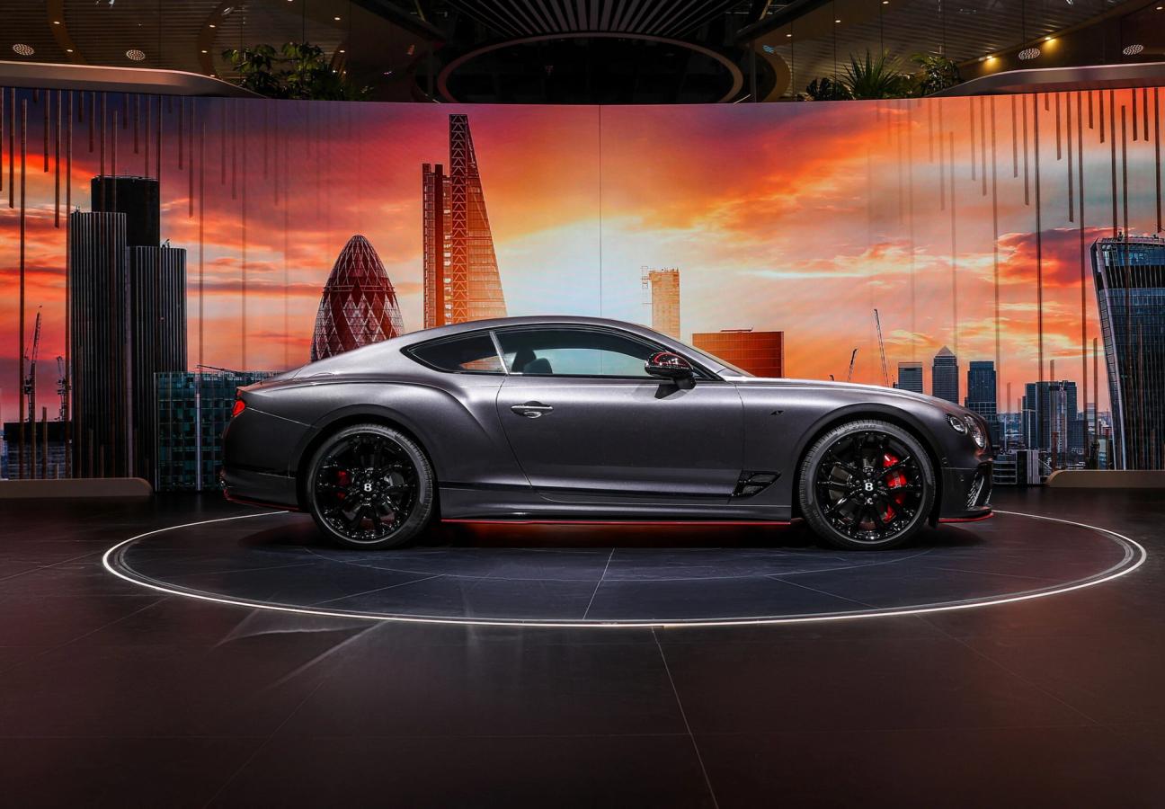 A one-of-one Bentley Continental GT S with the London Skyline behind from the side