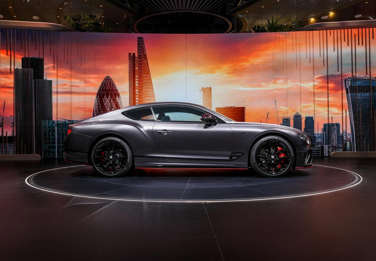 A one-of-one Bentley Continental GT S with the London Skyline behind from the side