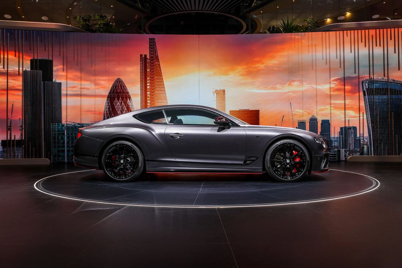 A one-of-one Bentley Continental GT S with the London Skyline behind from the side