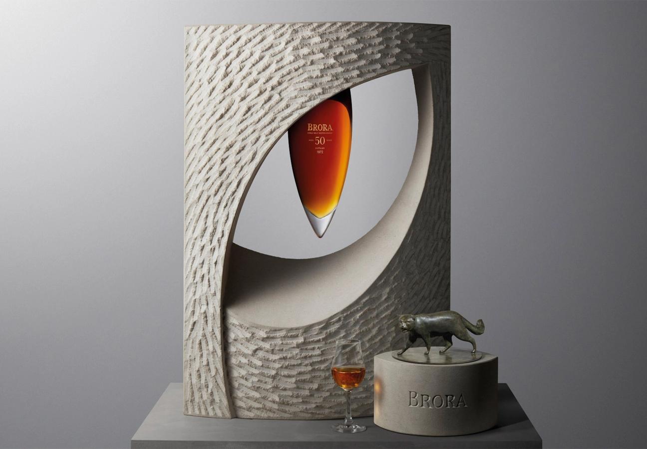 Iris whisky from Brora distillery presented in a sculptural cat eye art piece made of limestone