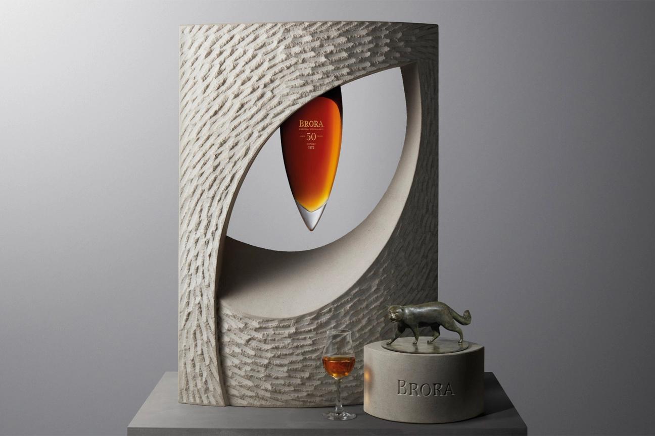 Iris whisky from Brora distillery presented in a sculptural cat eye art piece made of limestone