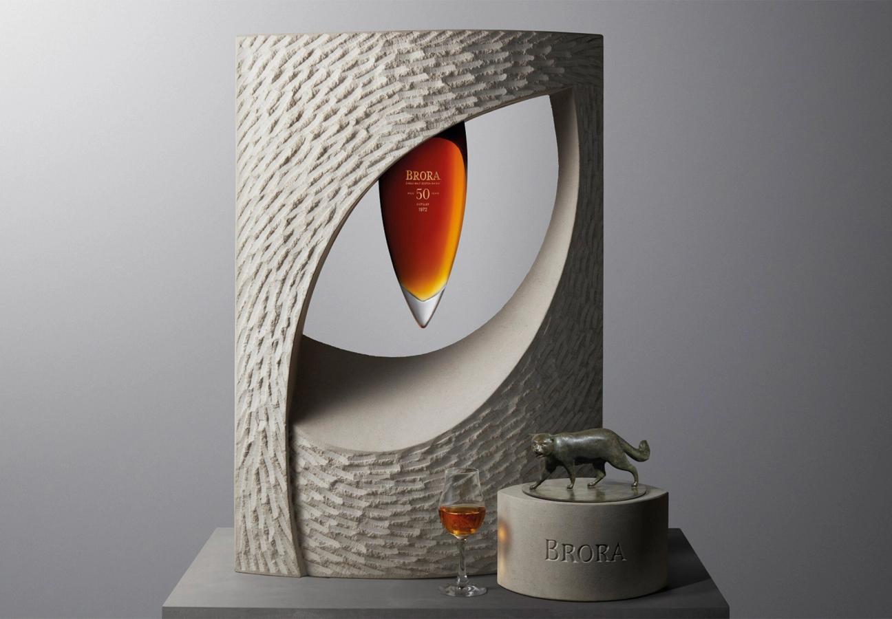 Iris whisky from Brora distillery presented in a sculptural cat eye art piece made of limestone