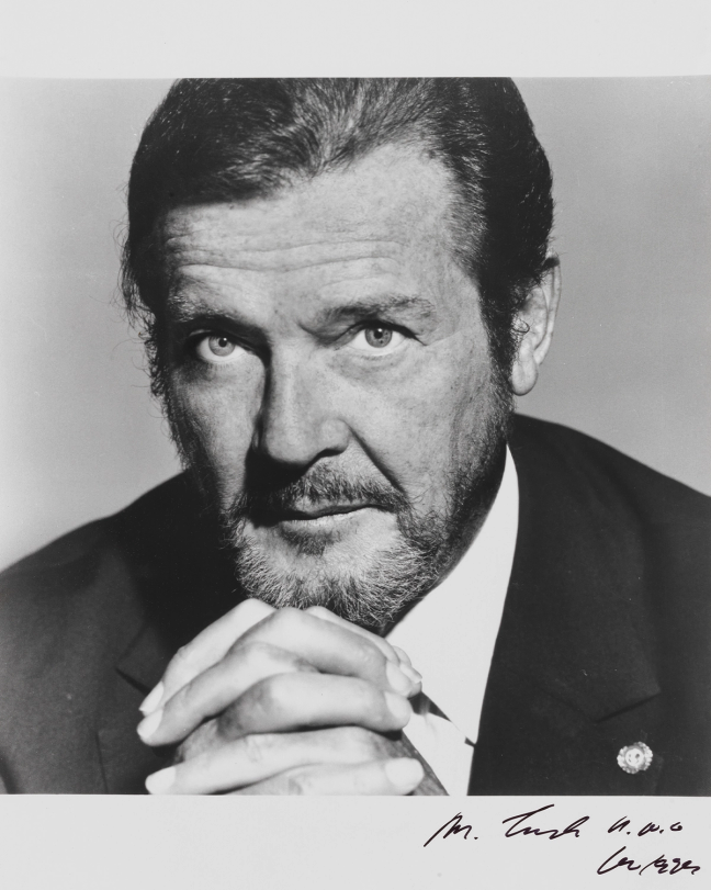 A large black-and-white portrait photograph of Sir Roger Moore